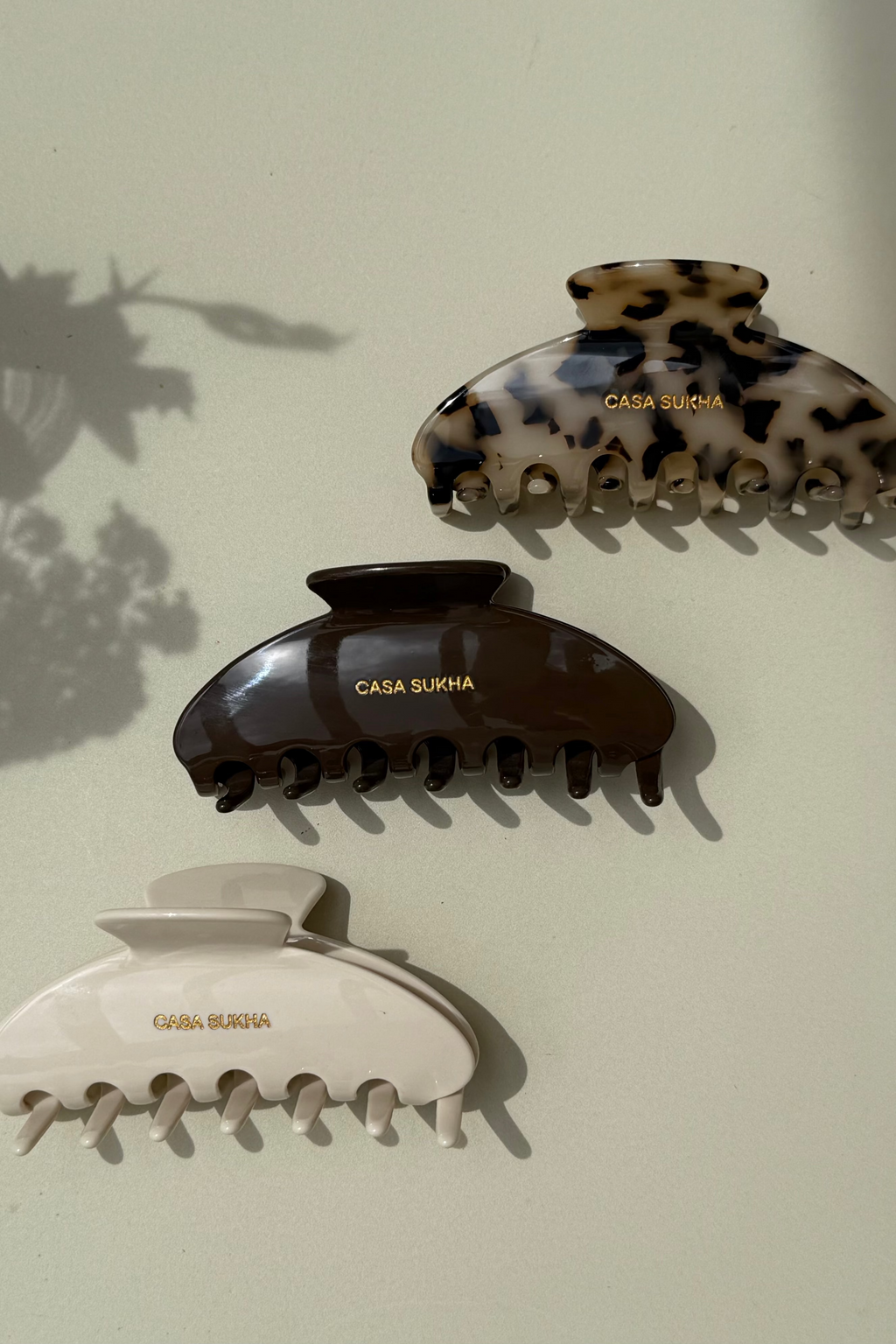 Casa Sukha beige and brown hairclips. 